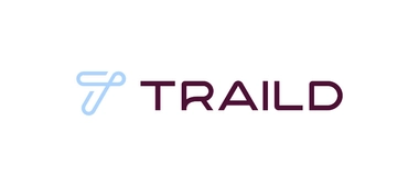 Traild logo with light blue stylized “T” and maroon text.
